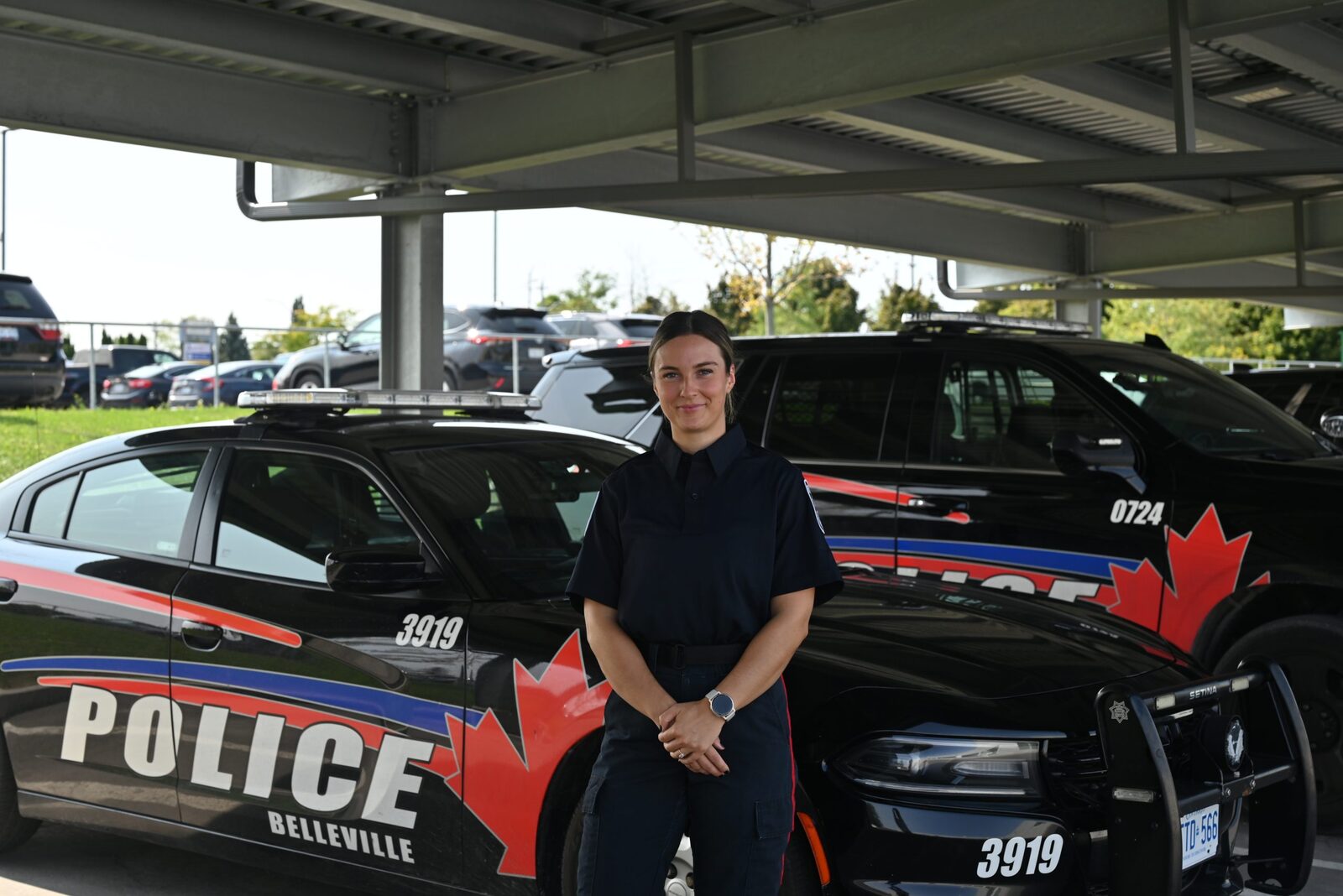 Belleville Police officer by patrol vehicles